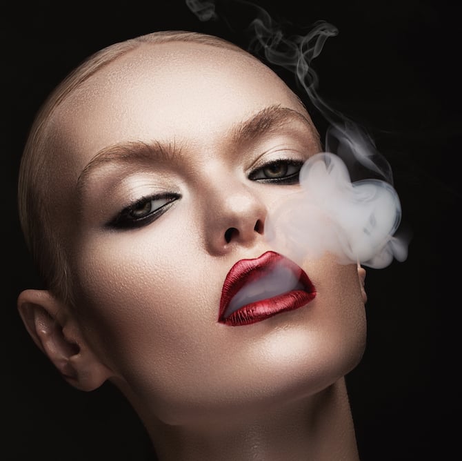 hot woman with smoke in mouth