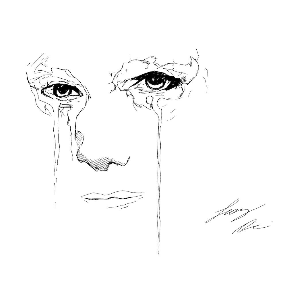 woman crying with tears flowing down her cheeks