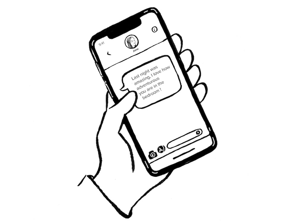 text message on phone being held in left hand