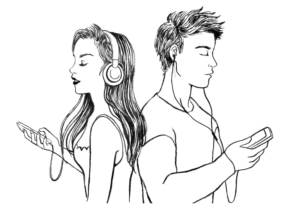 man with ear buds with his back to woman with headphones